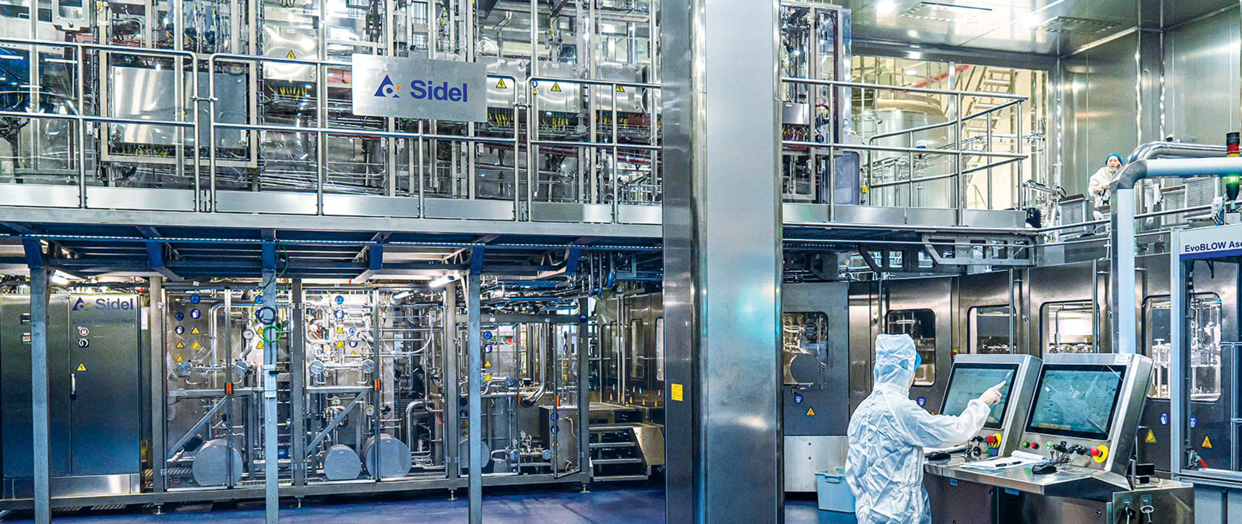 Sidel beverage line, operator in front of control paner