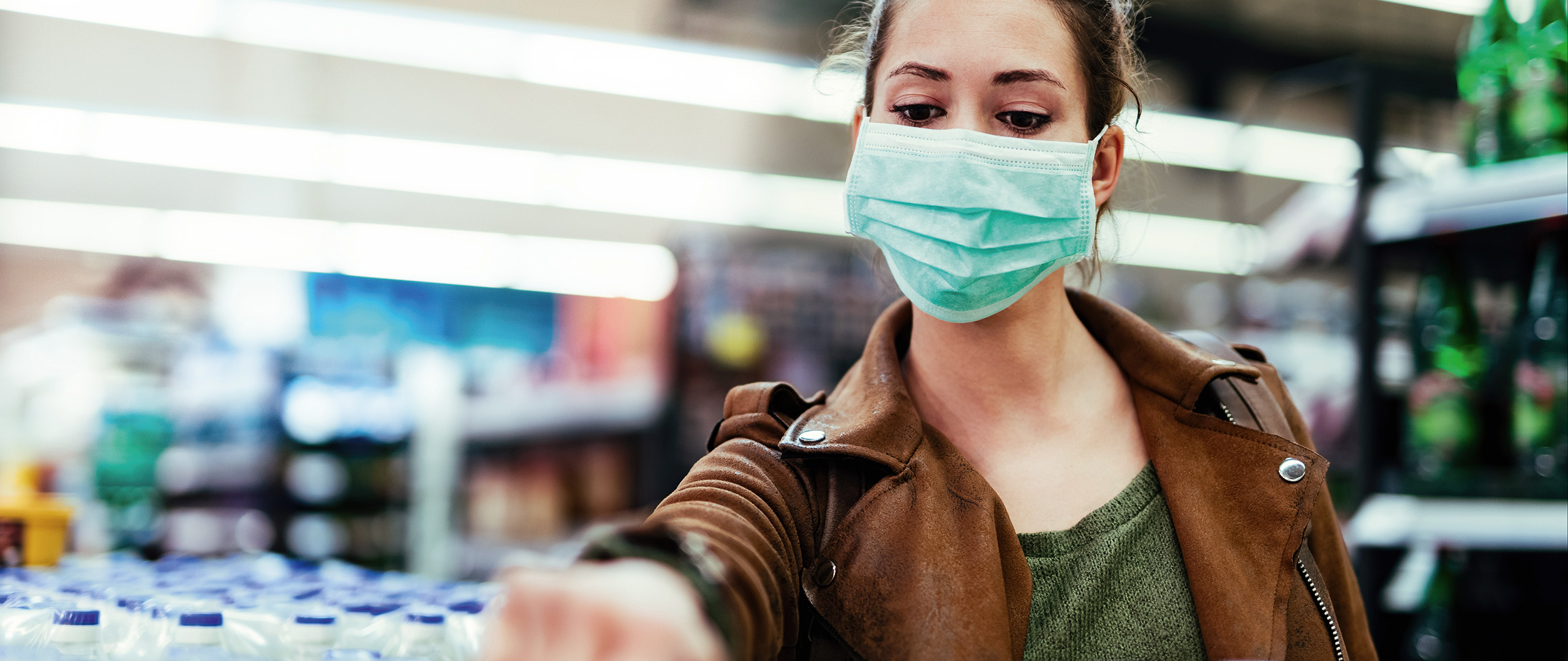 Woman with face mask in shop