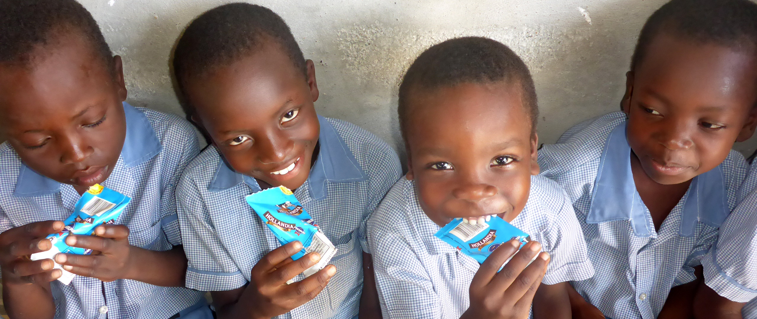 Boys drinking school milk